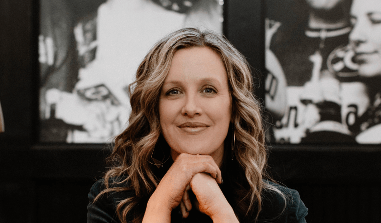 Annie Croner Headshot Laptop New - Featured - The Leader Assistant Podcast