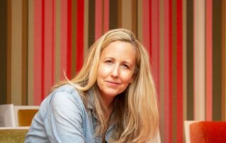 Laurie Woolever Headshot - Source - DAVID SCOTT HOLLOWAY featured - The Leader Assistant Podcast